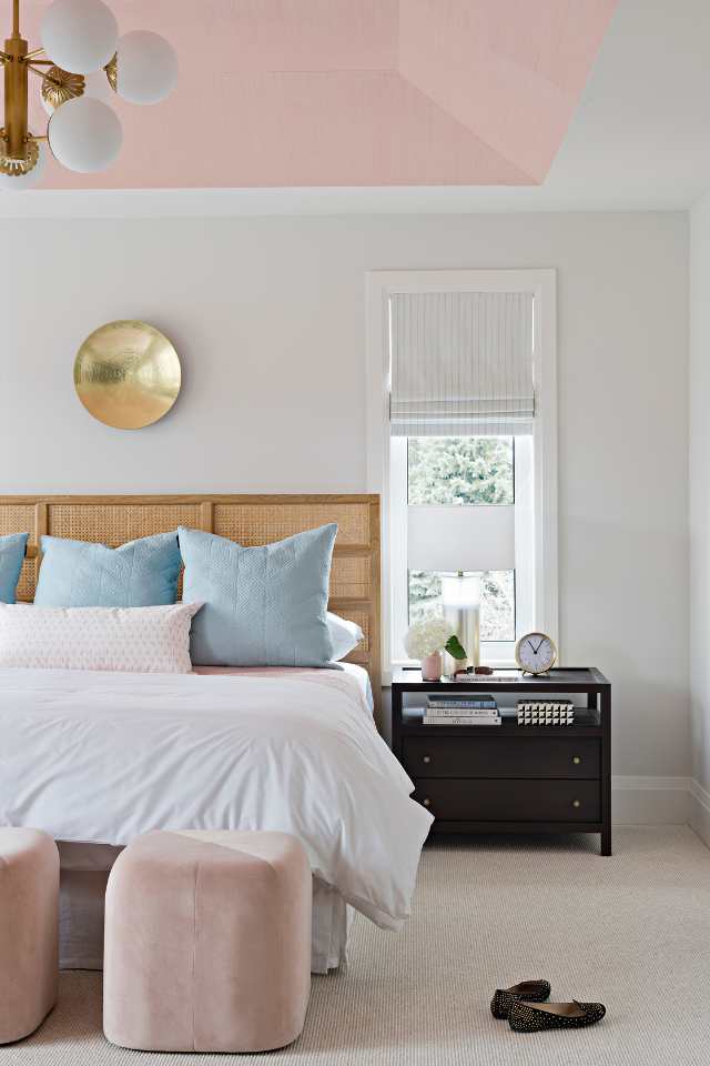 plush pink bedroom with plush carpeting and blue accents, gold hardware